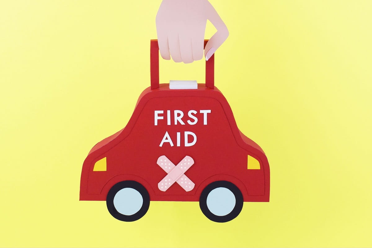first aid kit in hand